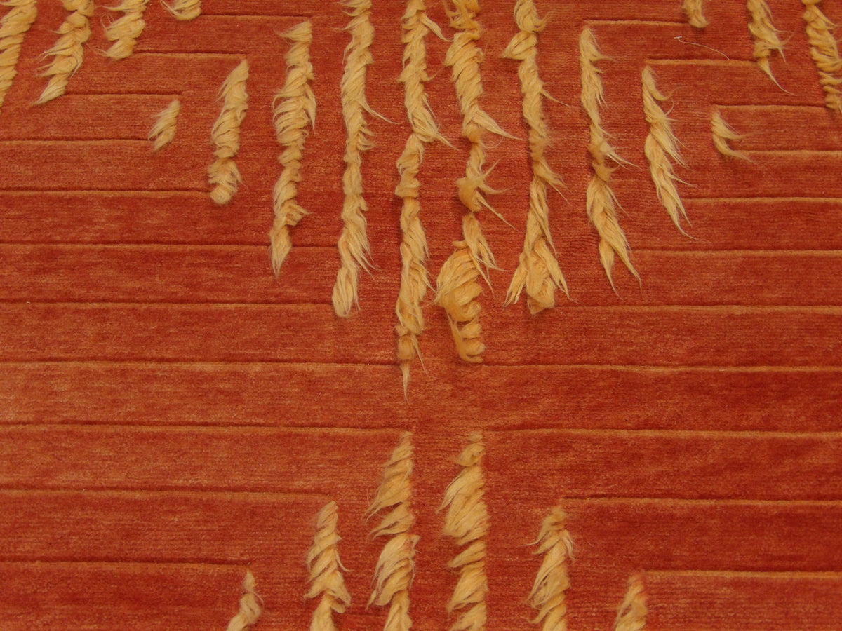 Shag rug edge and pile depth detail, gold and rust