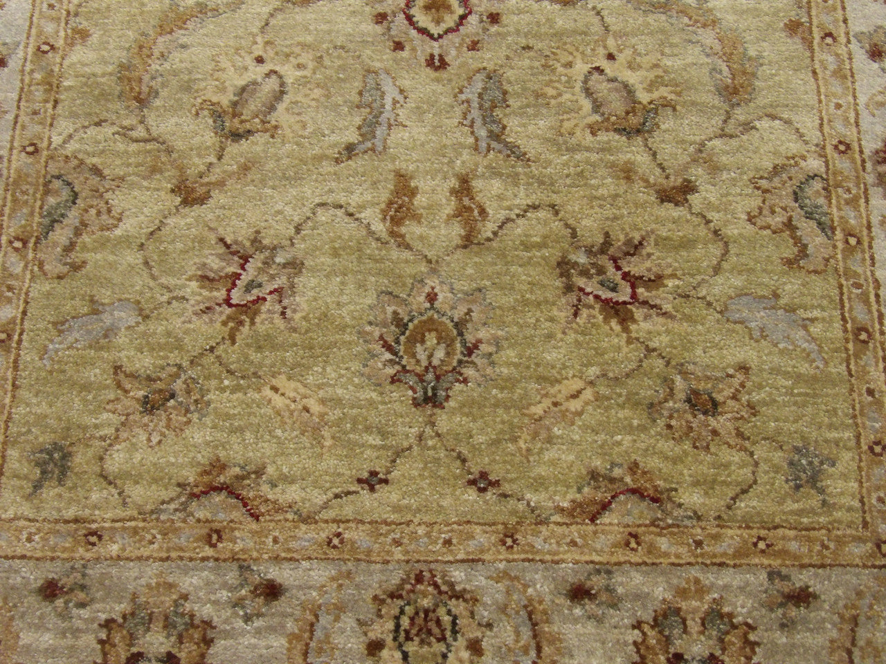 Wool texture close-up, green and gray Chobie rug