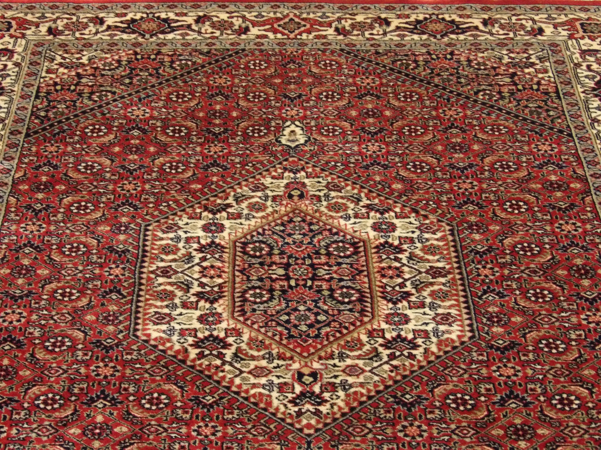 Wool texture close-up, red and beige Bidjar runner