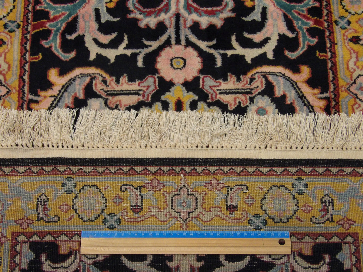 Black & Gold Persian Kashan Antique Wash rug in room setting