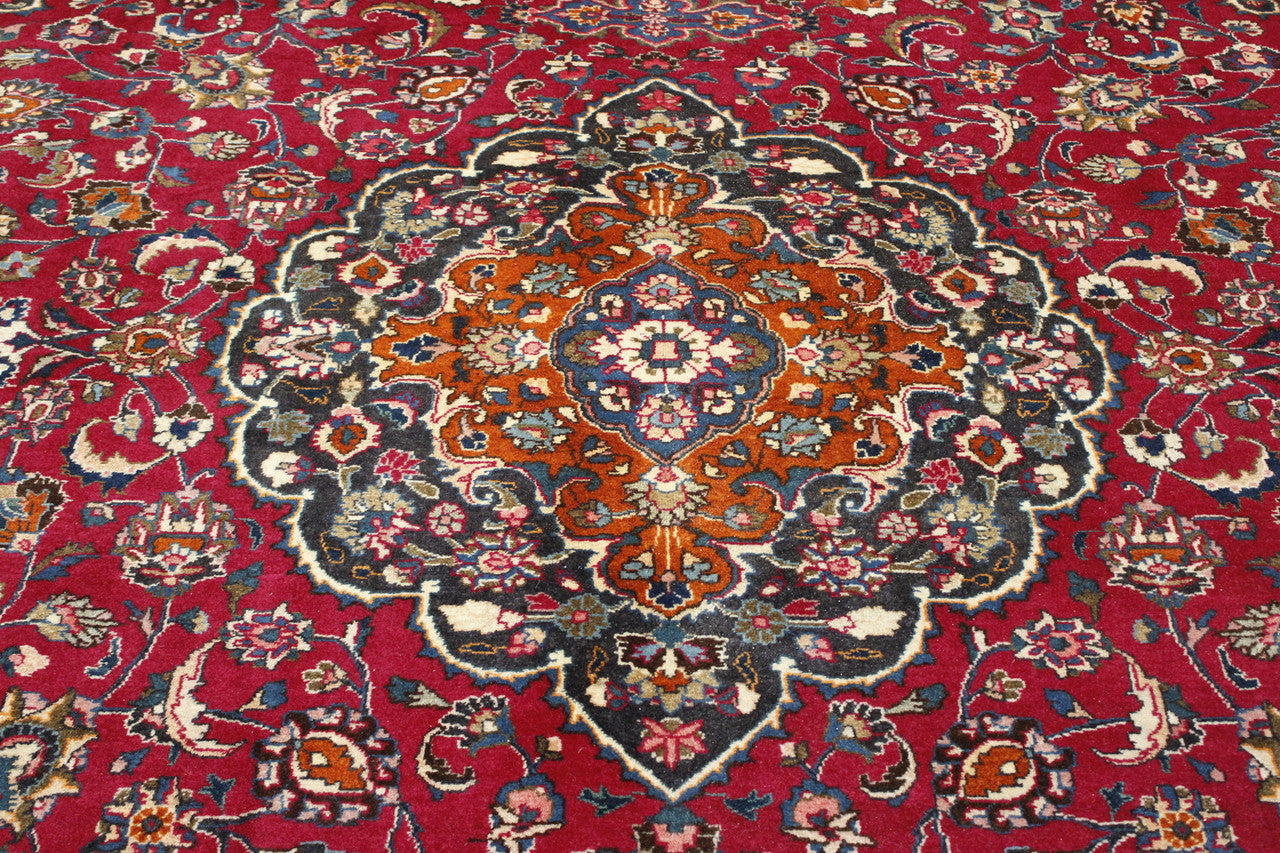 Beige & Red Traditional Antique Tabriz rug in room setting