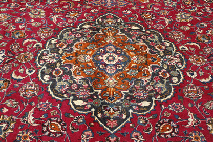 Beige & Red Traditional Antique Tabriz rug in room setting