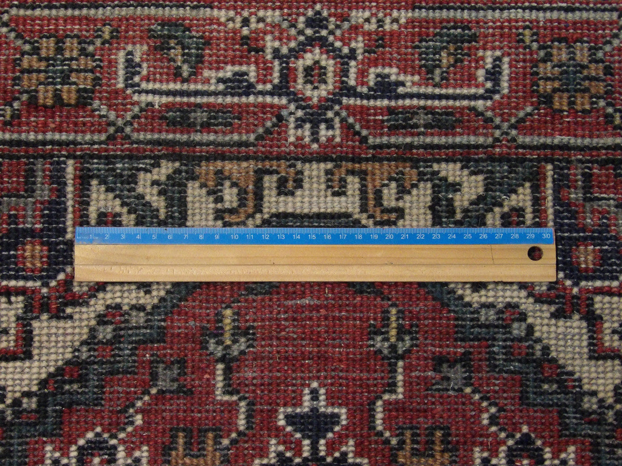 Full view of red Tribal Persian Heriz hand-knotted rug