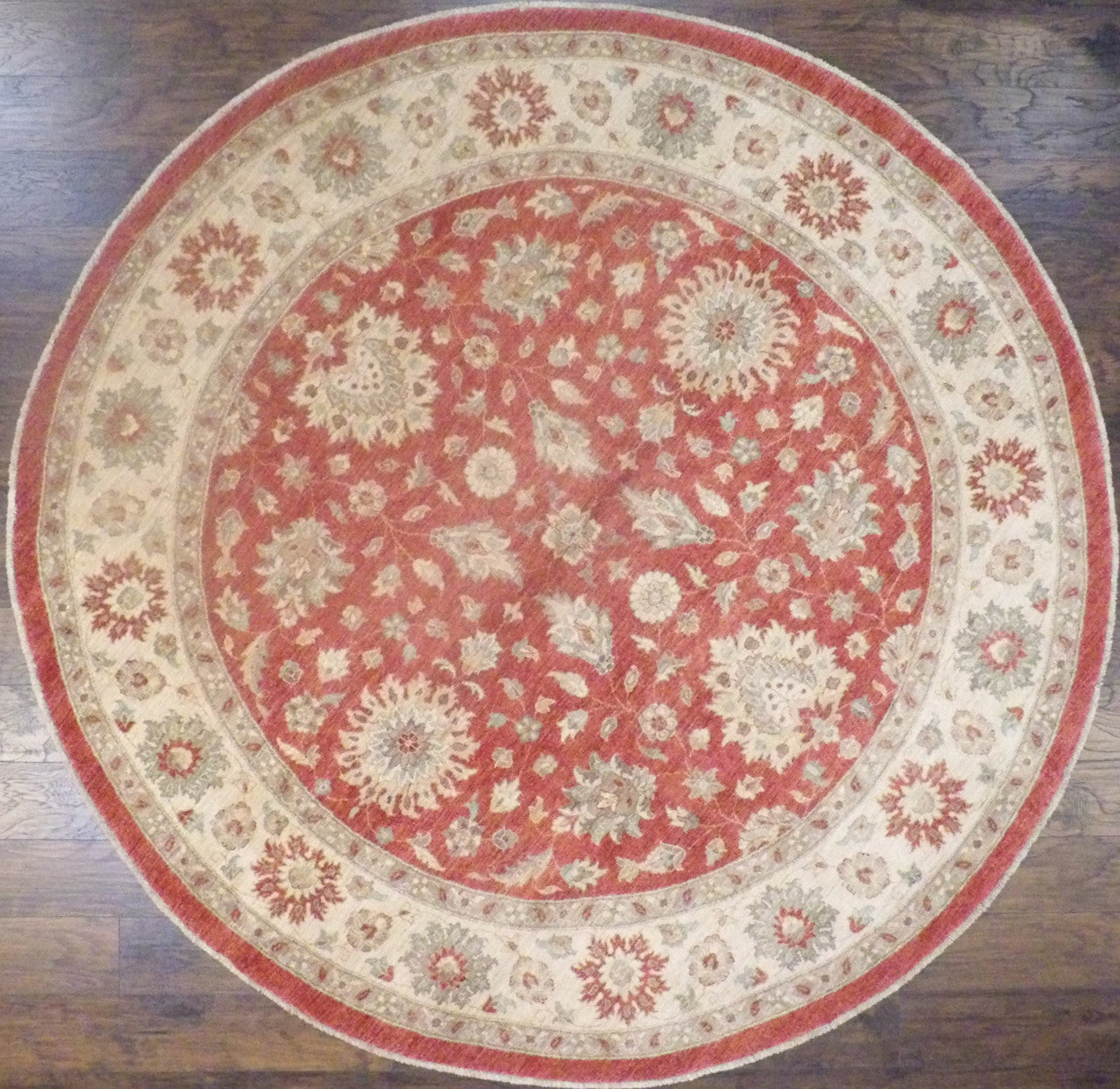 Oushak Chobi hand-knotted wool round rug in beige and red, full view