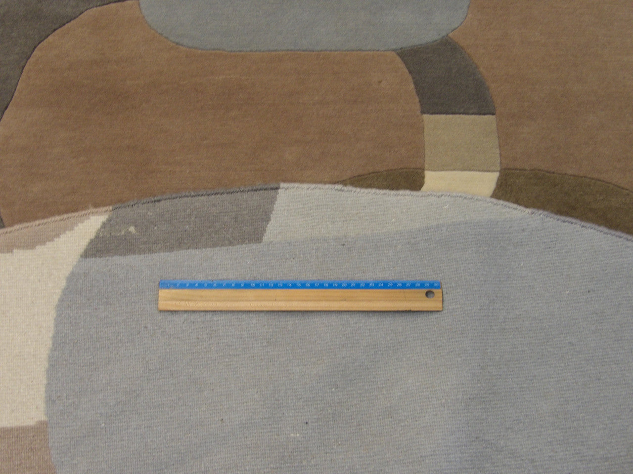 Brown & Beige Modern Circle Design rug in room setting
