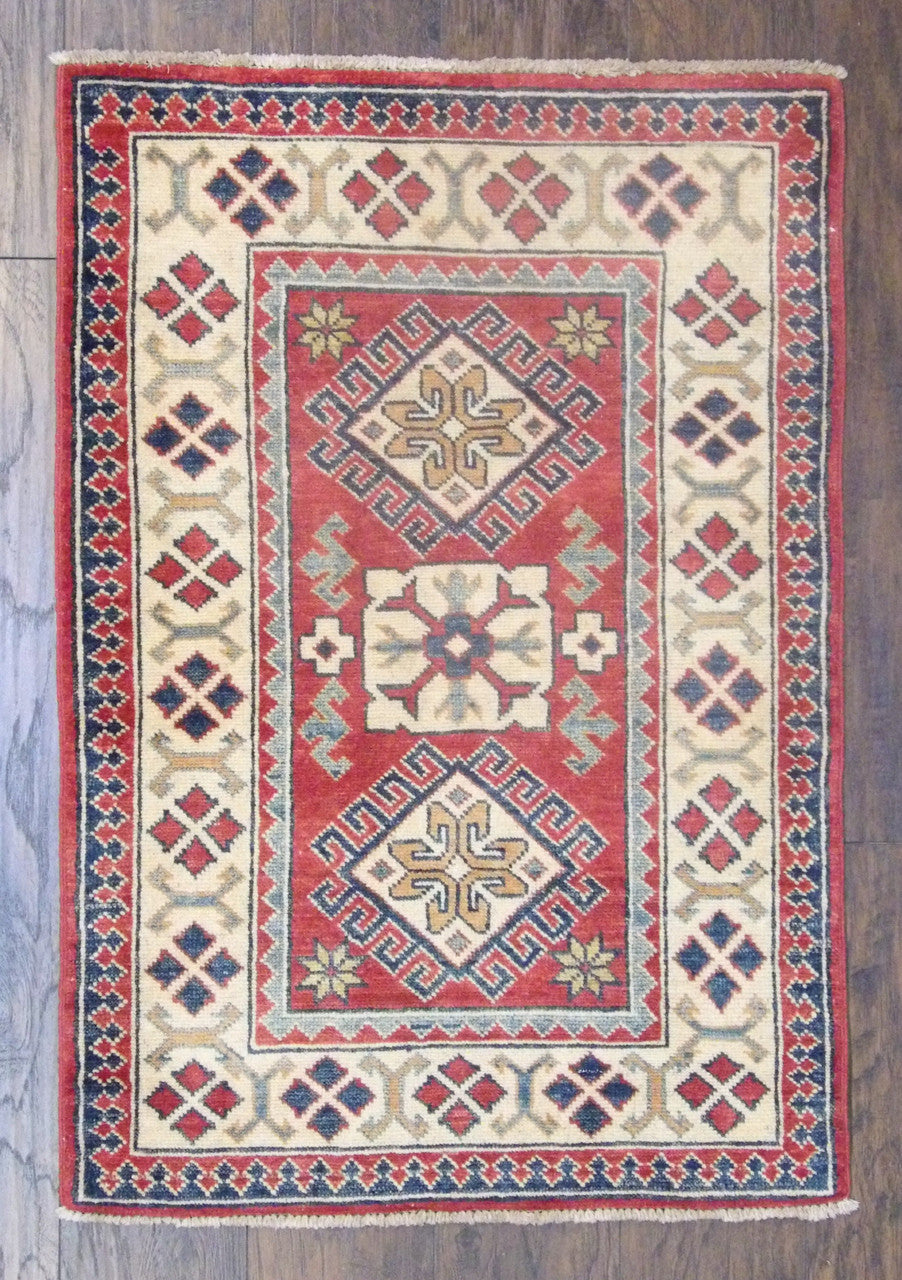 Tribal Super Kazak hand-knotted wool rug in beige and red, full view