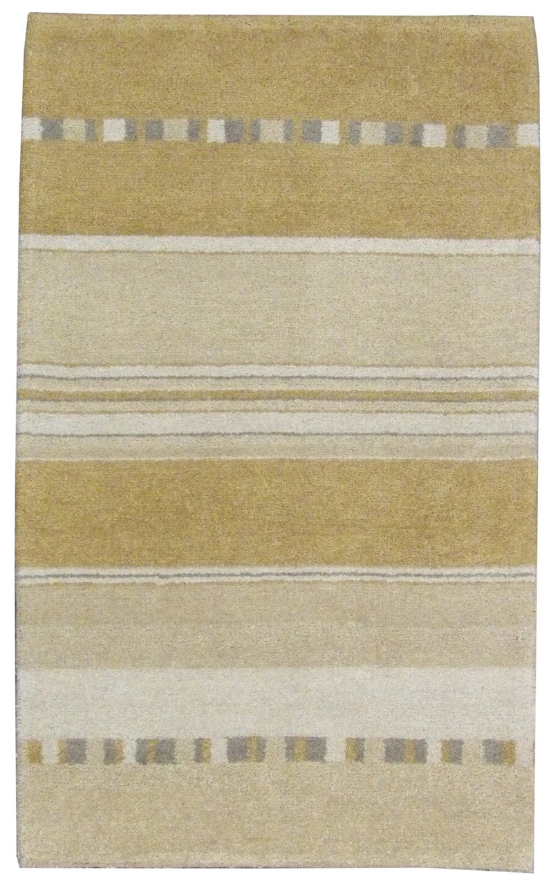 Modern hand-knotted wool rug in gold, full view