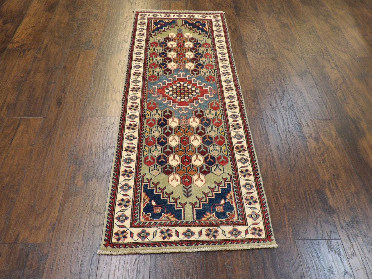 Full length view of tribal Kazak runner