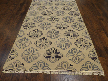 Close-up of flatweave texture, gold coastal rug
