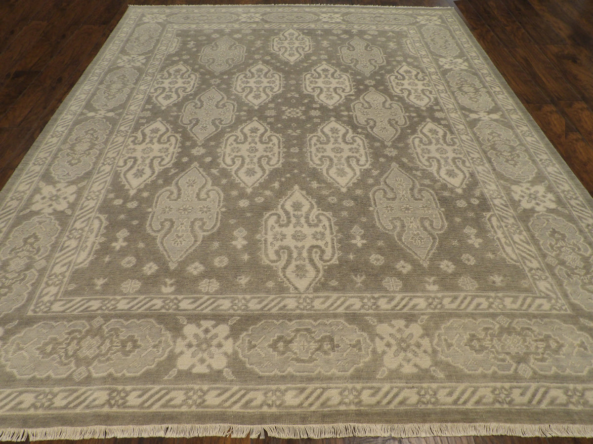 Close-up of wool pile, green and beige rug