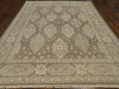 Close-up of wool pile, green and beige rug