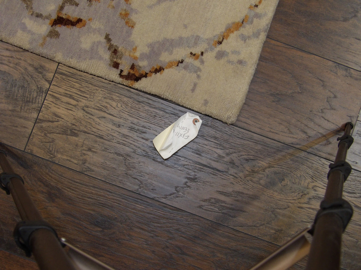 Gold and purple abstract rug in room setting