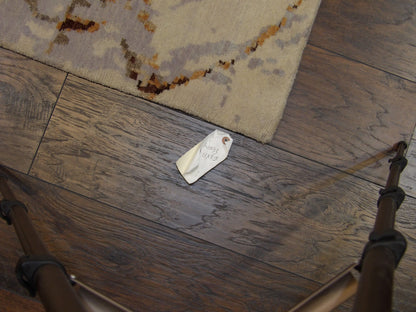 Gold and purple abstract rug in room setting