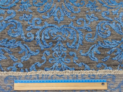 Blue and gray damask runner in hallway setting