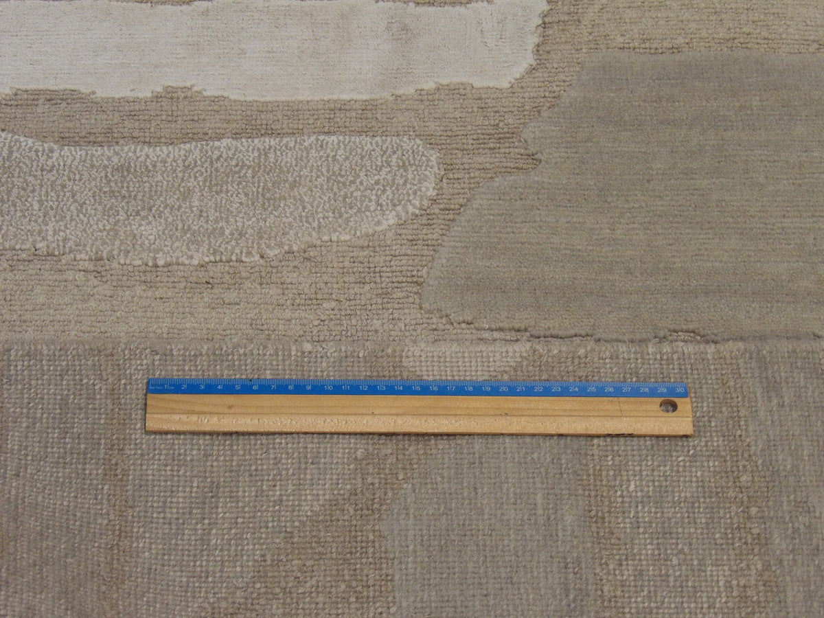 Gray and beige abstract rug in room setting
