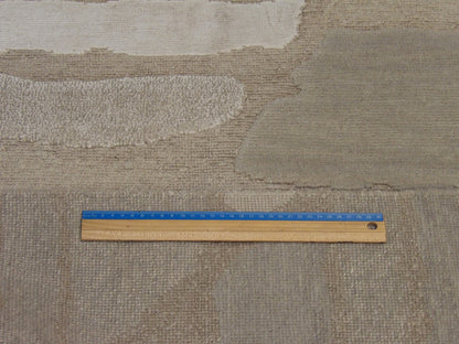 Gray and beige abstract rug in room setting