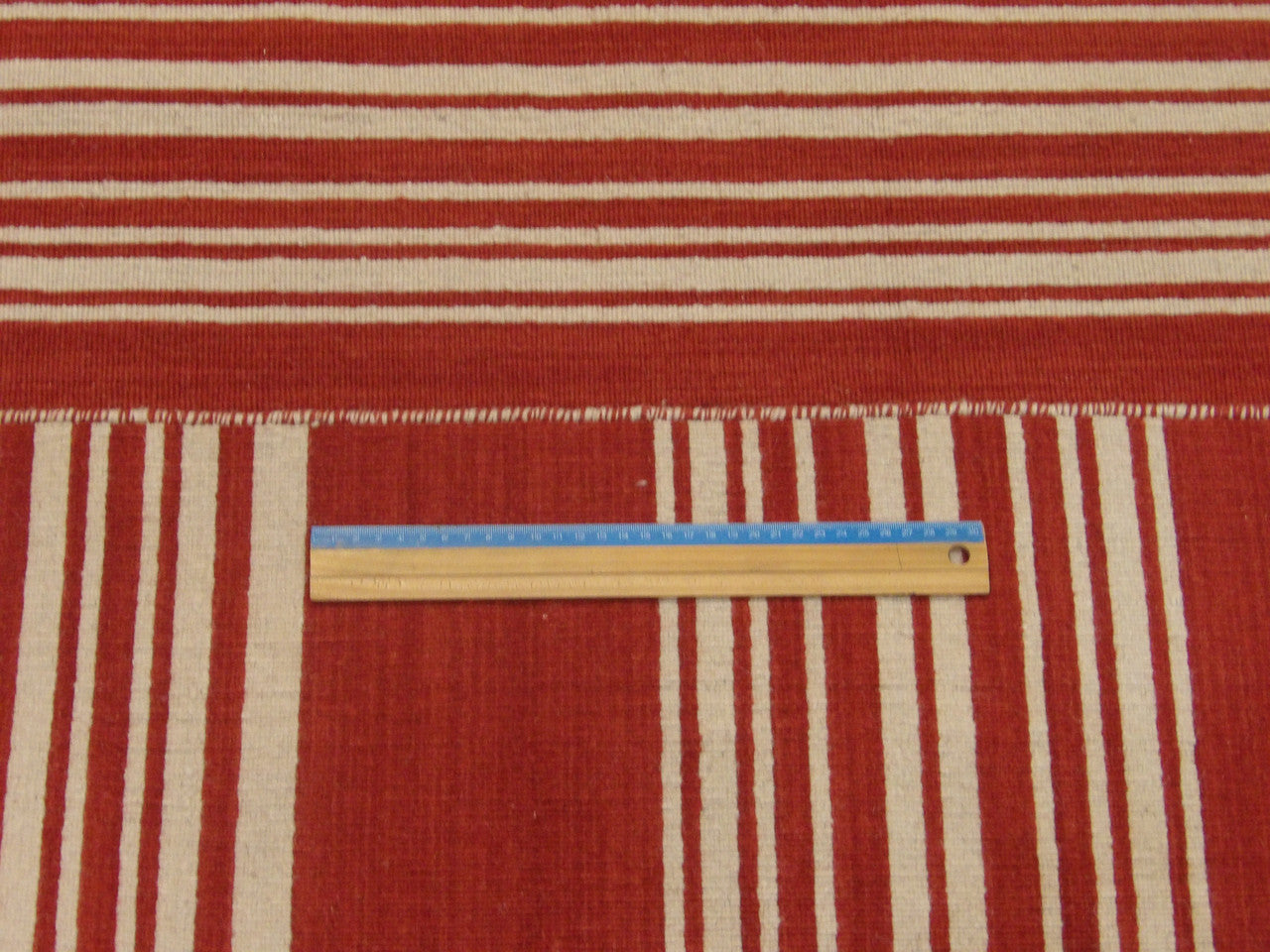 Full room view of coastal flat weave hand-knotted rug