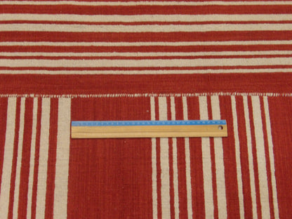 Full room view of coastal flat weave hand-knotted rug