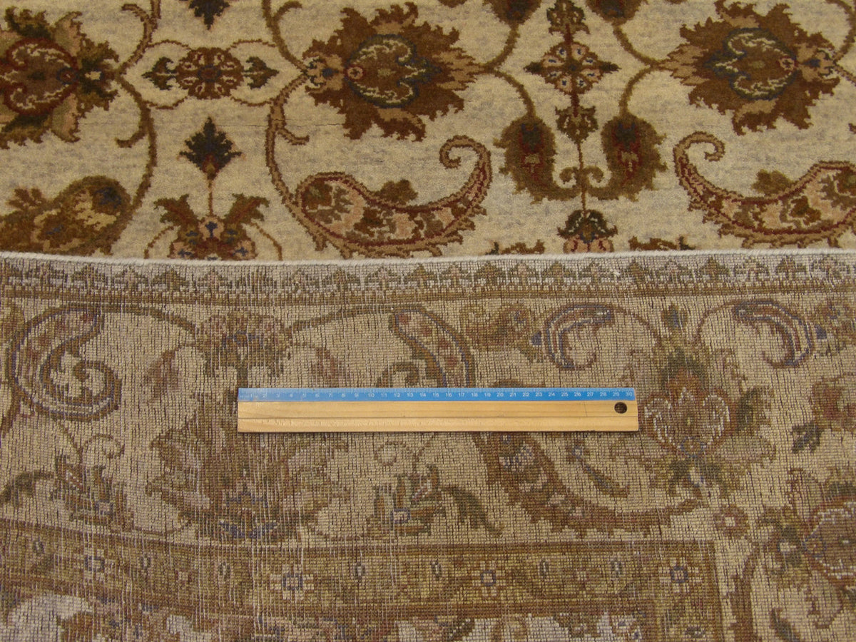 Gold and ivory Ziegler rug in room setting