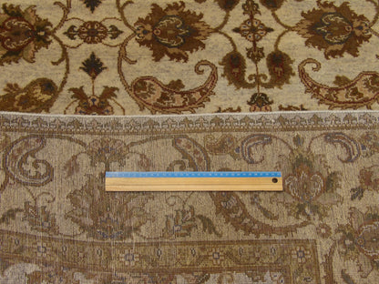 Gold and ivory Ziegler rug in room setting
