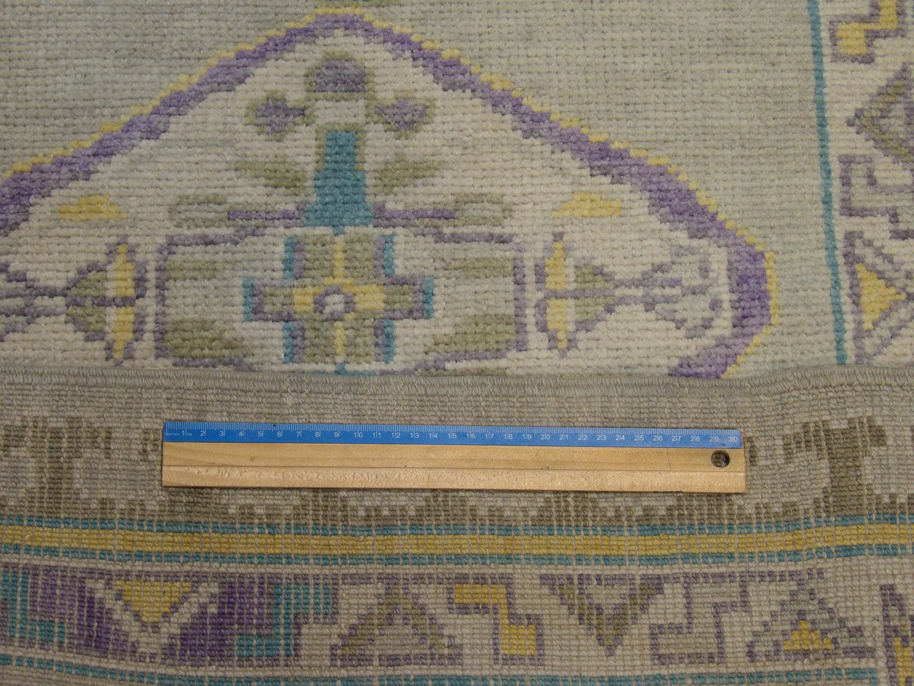 Gray & Purple Anatolian Vintage Oushak rug in room setting