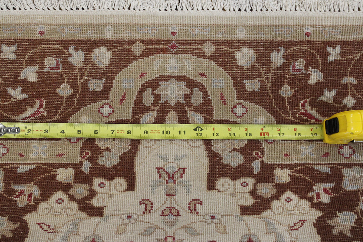 Beige Traditional Jaipur Tabriz Design rug in room setting