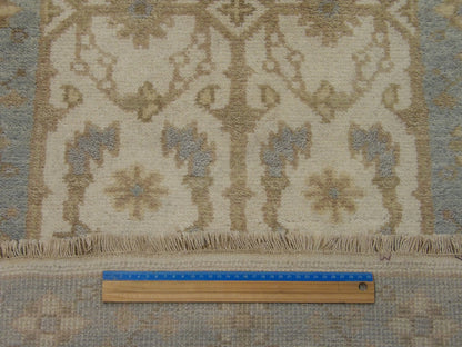 Blue and ivory Oushak runner in hallway setting