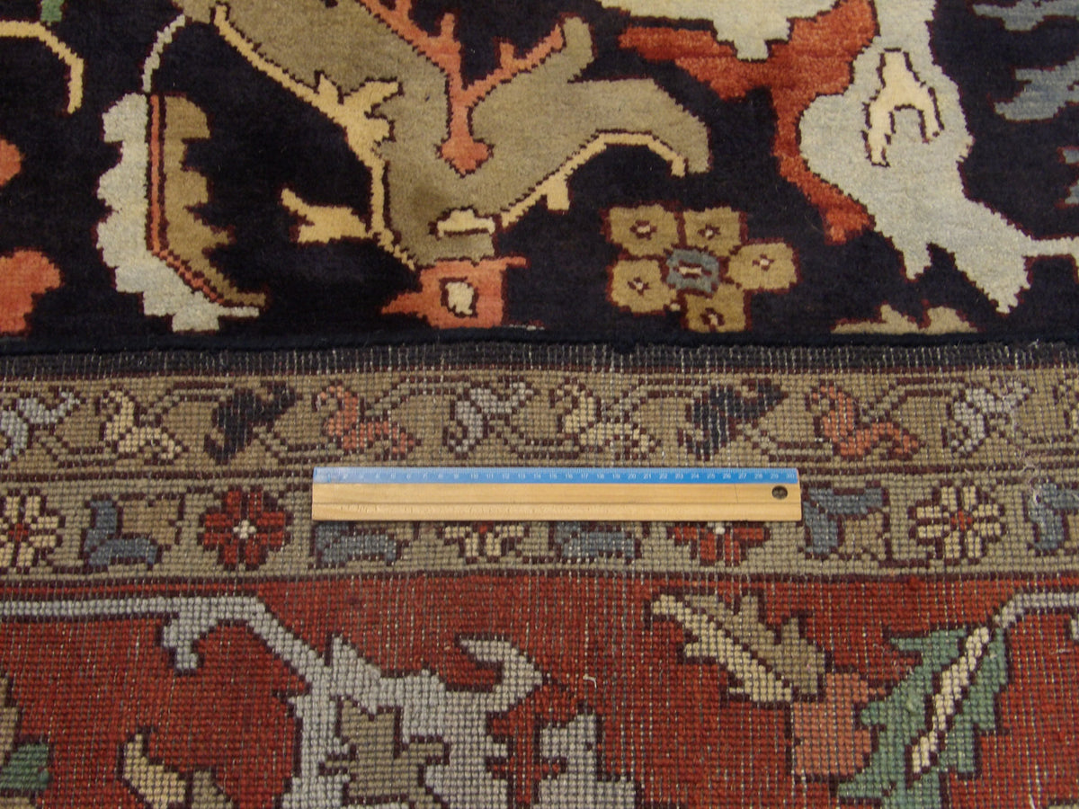 Blue and red Ziegler rug in room setting