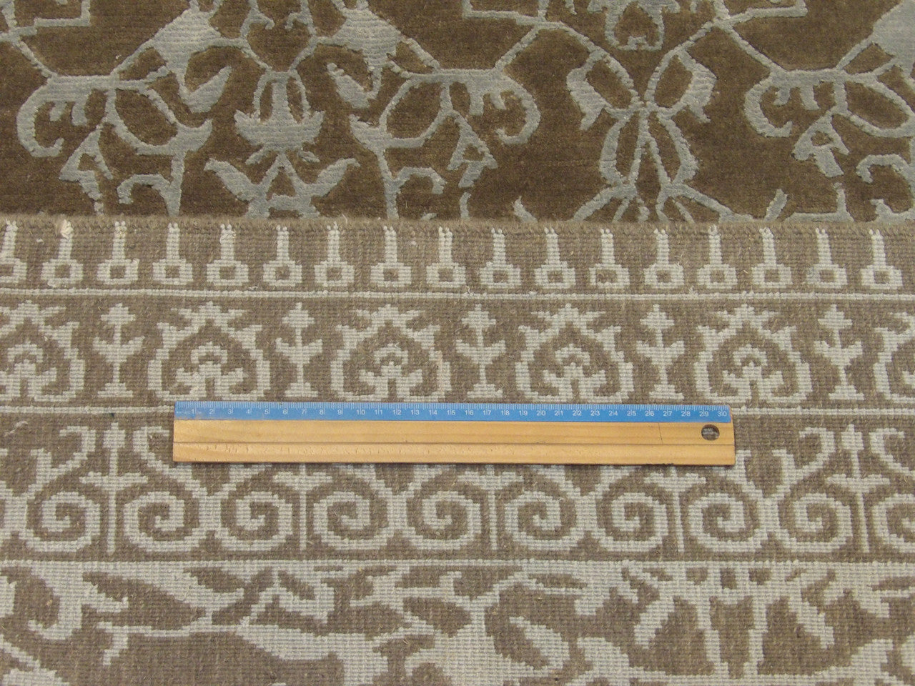 Full room view of transitional damask hand-knotted rug