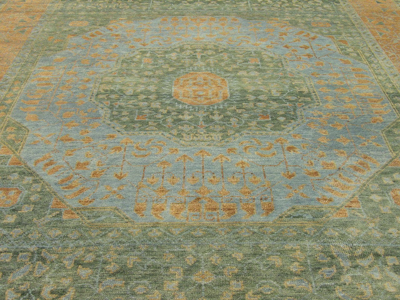 Green & Rust Tribal Mamluk Vegetable Dye rug in room setting