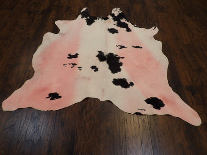Close-up of cowhide texture and markings, pink