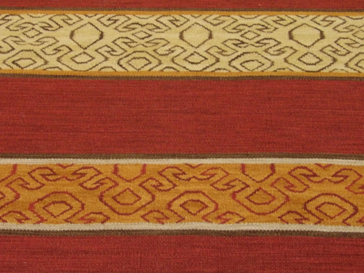 Wool texture close-up, gold and rust kilim rug