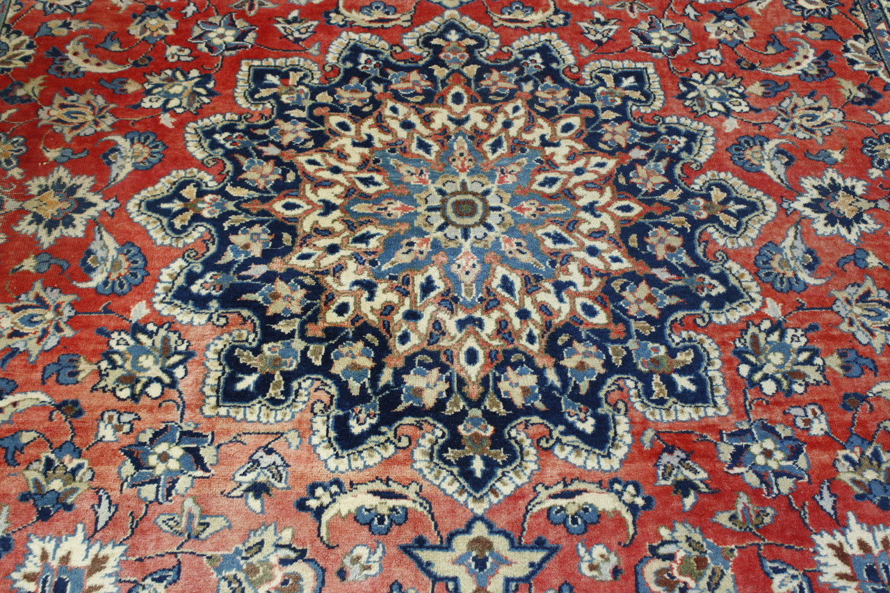 Blue & Red Traditional Antique Tabriz rug in room setting