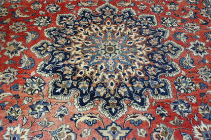 Blue & Red Traditional Antique Tabriz rug in room setting