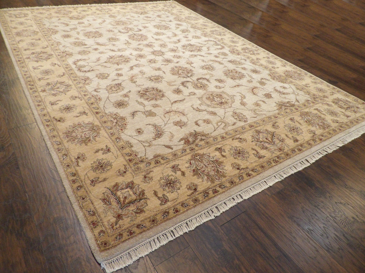 Beige and gold Ziegler rug in a formal living room setting