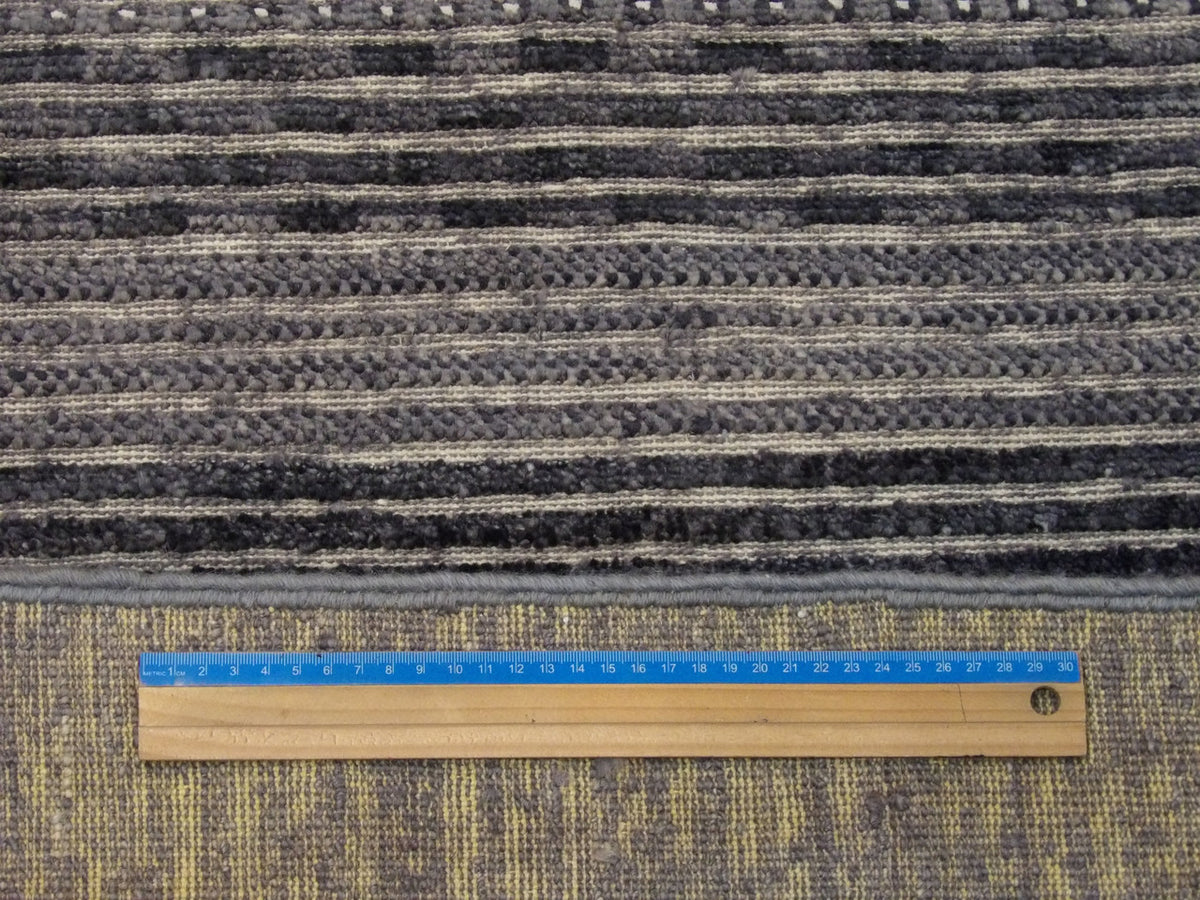 Gray Modern Gabbeh Flat Pile rug in room setting