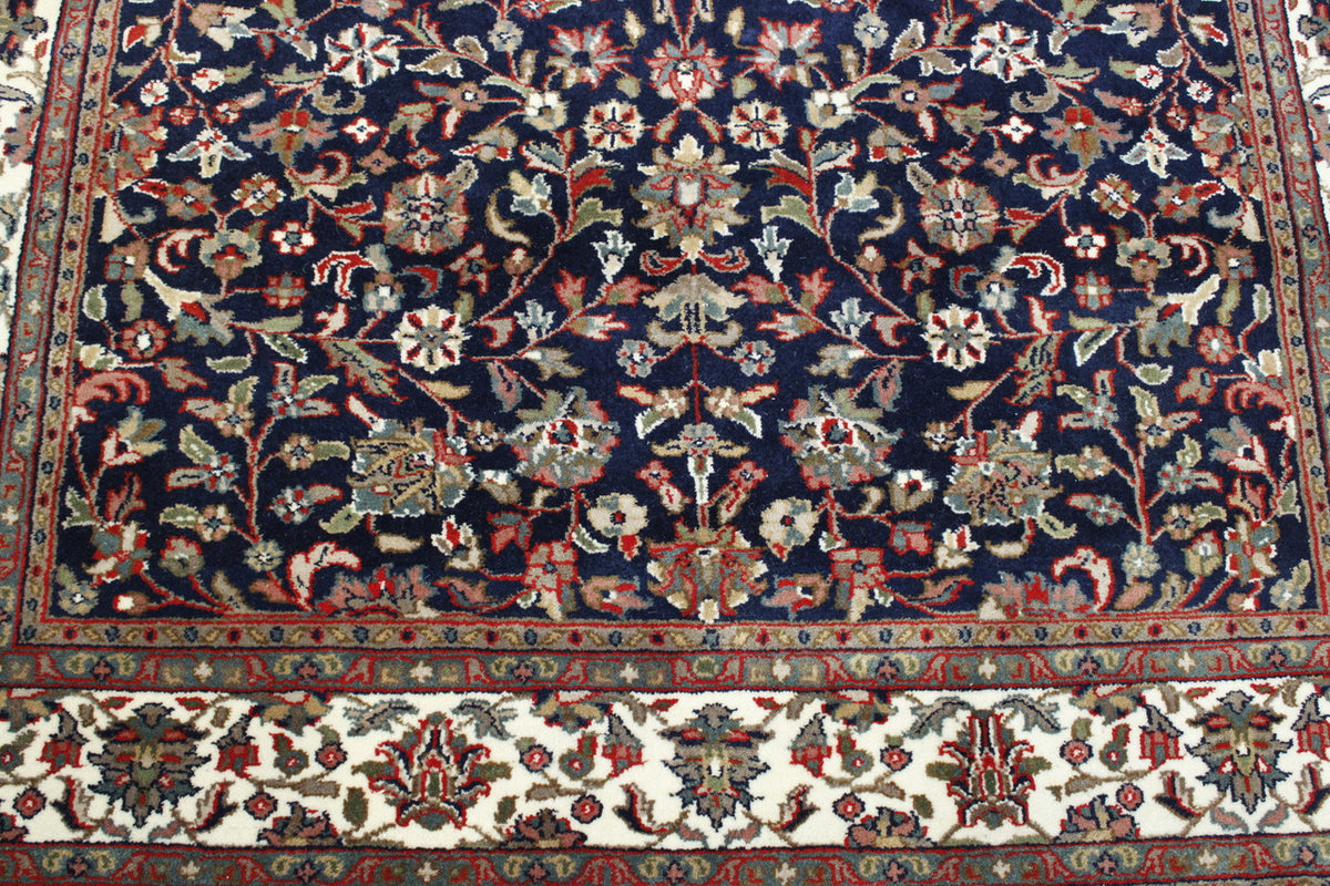 Blue & Beige Traditional Fine Heraki rug in room setting
