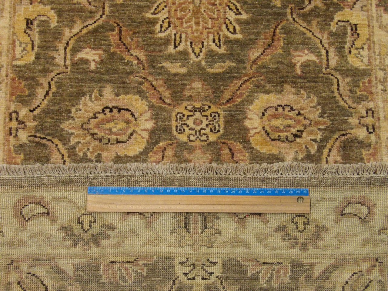 Green & Ivory Oushak Chobi Natural Dye rug in room setting