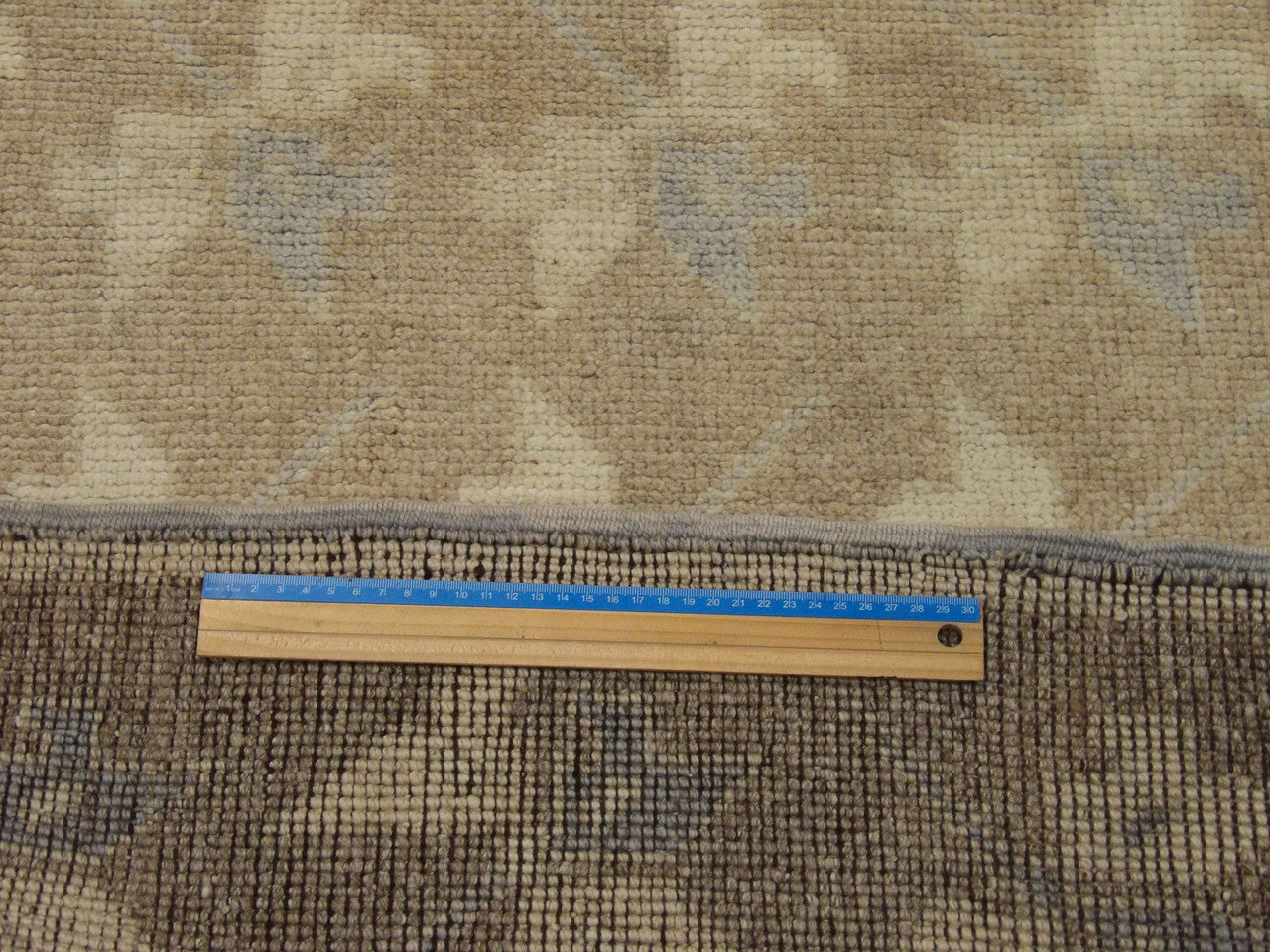 Brown & Beige Anatolian Vintage Oushak rug in room setting