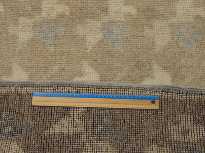 Brown & Beige Anatolian Vintage Oushak rug in room setting