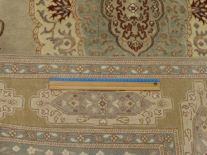 Blue & Gold Fine Persian Haji Jalili Tabriz rug in room setting