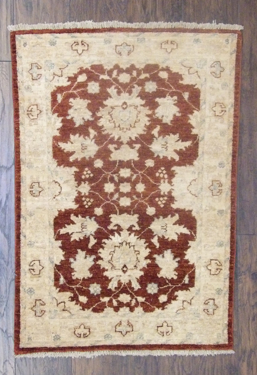 Oushak Chobi hand-knotted wool rug in beige and red, full view