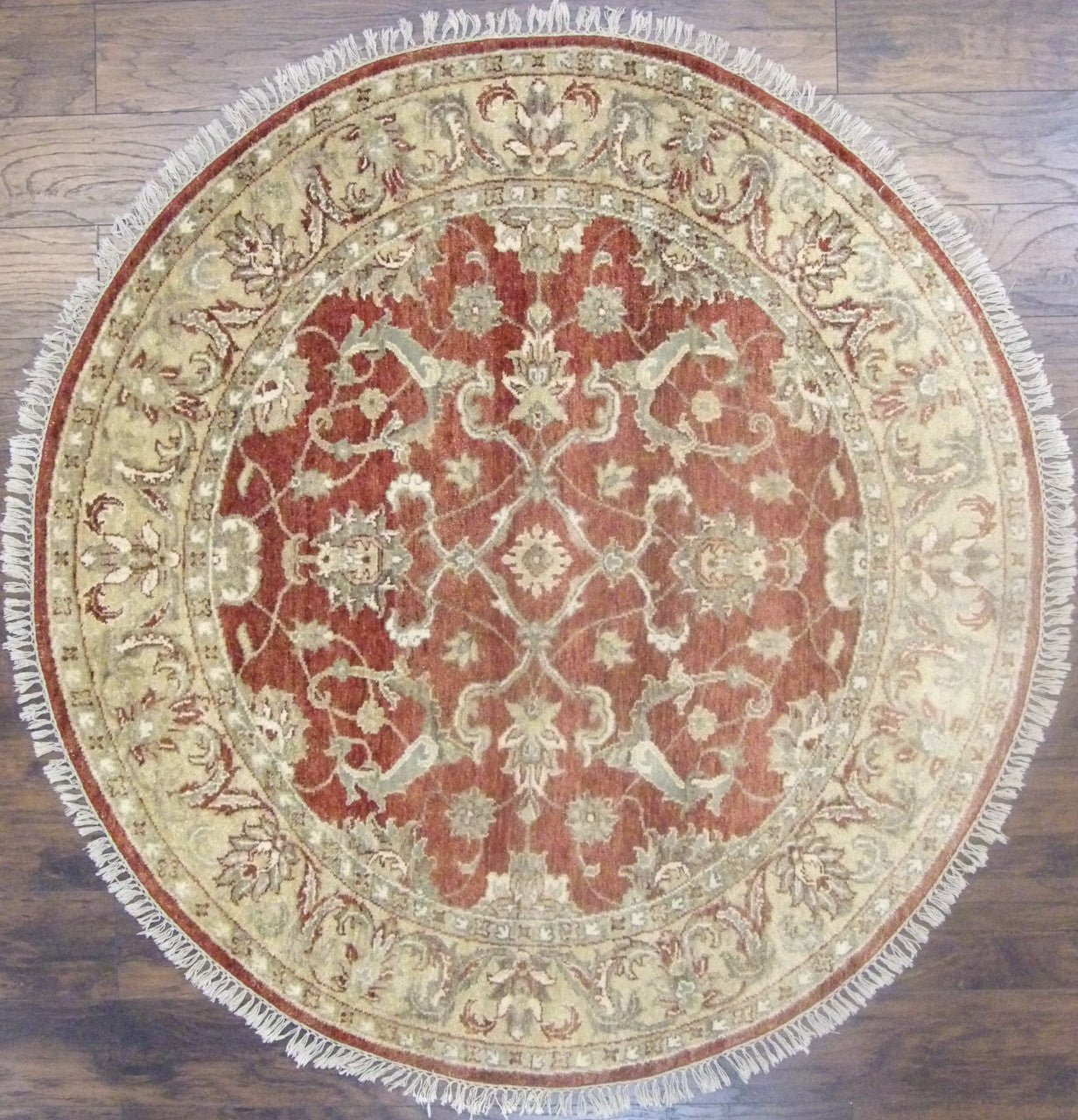 Jaipur Kashan hand-knotted wool round rug in gold and rust, full view