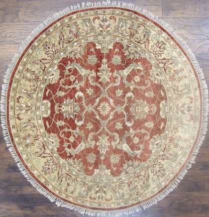 Jaipur Kashan hand-knotted wool round rug in gold and rust, full view