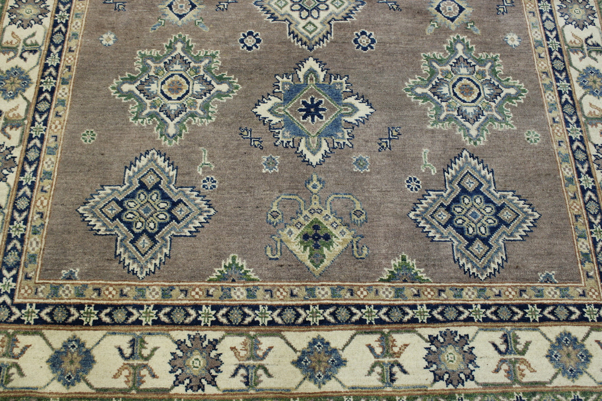 Brown & Beige Tribal Super Kazak rug in room setting