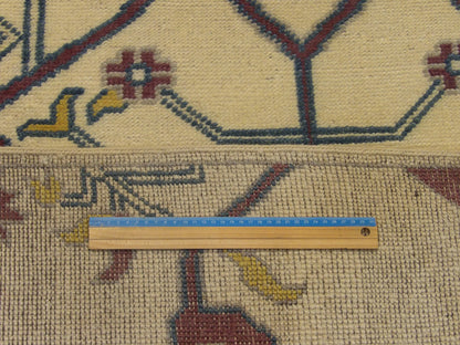 Full room view of natural Ziegler hand-knotted rug