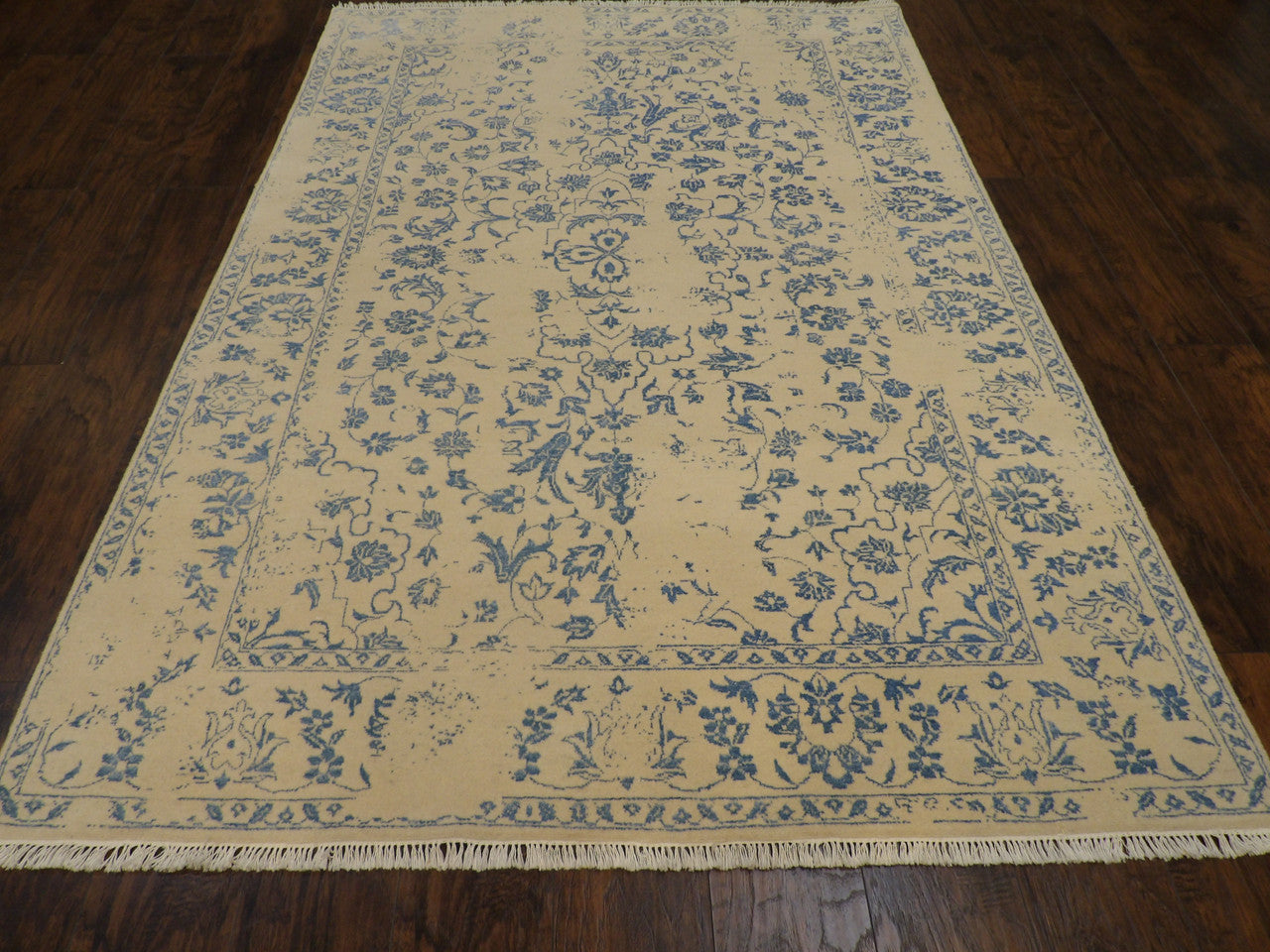 Close-up of wool-silk pile, blue and ivory rug