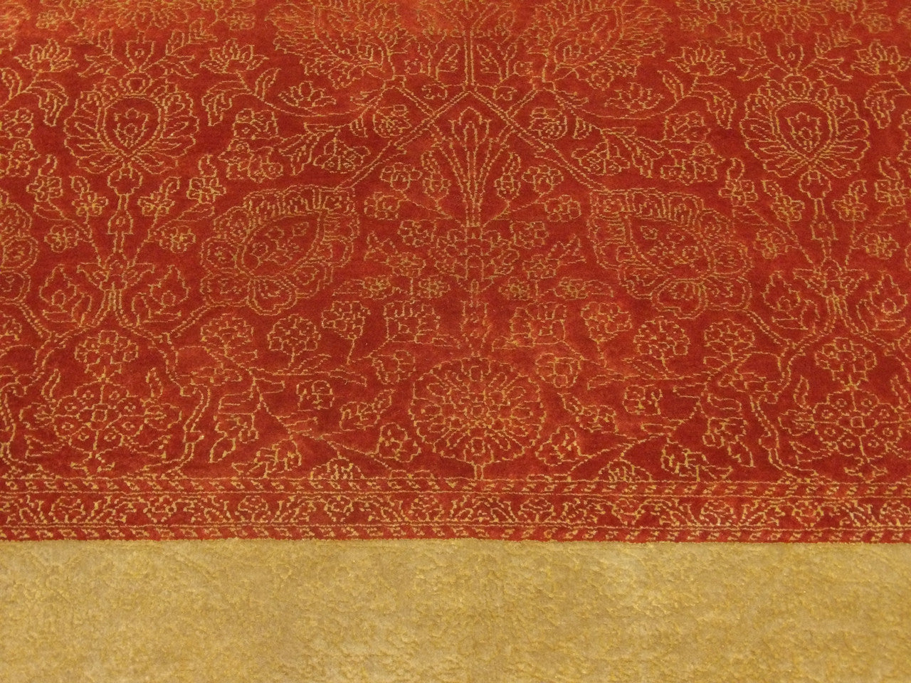 French design rug border detail, gold and red