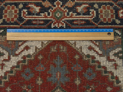 Blue and red Heriz rug in room setting