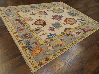 Blue and ivory colorful Oushak rug in a living room setting